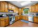 Well-equipped kitchen with modern appliances and custom cabinetry at 403 N Red Gold Dr, Trafalgar, IN 46181
