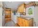 Functional laundry room featuring a washer and dryer, cabinets, and a window at 403 N Red Gold Dr, Trafalgar, IN 46181