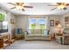 Comfortable living room with neutral tones, plush seating, and large windows offering scenic views at 403 N Red Gold Dr, Trafalgar, IN 46181