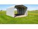 Open-sided outbuilding in a green field at 403 N Red Gold Dr, Trafalgar, IN 46181