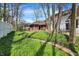 Lush backyard with stone pathway, well-maintained lawn, and privacy fence creates a serene outdoor retreat at 424 Orchard Blvd, Danville, IN 46122