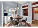 Cozy breakfast nook featuring a round table, backyard views, and access to the laundry area at 424 Orchard Blvd, Danville, IN 46122