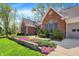 Lovely brick home with landscaped flower beds and a well-maintained green lawn at 424 Orchard Blvd, Danville, IN 46122