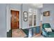 Inviting foyer with a solid wood door, light blue walls, and classic tile flooring at 424 Orchard Blvd, Danville, IN 46122