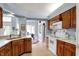 Well-lit kitchen with wood cabinets, white countertops, and modern appliances at 424 Orchard Blvd, Danville, IN 46122