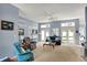 Bright and airy living room with plush seating and access to the outdoor area at 424 Orchard Blvd, Danville, IN 46122