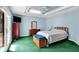 Main bedroom featuring a tray ceiling, fan, and private backyard access at 424 Orchard Blvd, Danville, IN 46122