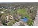 Beautiful aerial view of a vibrant park featuring sports courts, playground, walking paths, and lush green spaces for recreation at 4464 Four Seasons Cir, Indianapolis, IN 46226