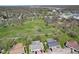 Picturesque aerial view of the community, showcasing the charming homes surrounded by lush greenery and a neighborhood park at 4464 Four Seasons Cir, Indianapolis, IN 46226