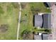 Aerial view of the backyard features a lush green lawn, a charming patio, and beautiful landscaping, perfect for outdoor living at 4464 Four Seasons Cir, Indianapolis, IN 46226