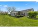 Charming home featuring a well-maintained lawn and lush landscaping on a sunny day at 4464 Four Seasons Cir, Indianapolis, IN 46226