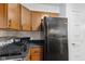 This kitchen is equipped with modern appliances and brown cabinets for ample storage at 4464 Four Seasons Cir, Indianapolis, IN 46226