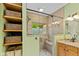 Modern bathroom featuring a glass door shower and elegant stone countertops at 4541 Greenthread Ct, Zionsville, IN 46077