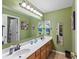 Bathroom features a double sink vanity and plenty of lighting at 4541 Greenthread Ct, Zionsville, IN 46077