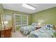 Charming bedroom features twin beds, a window and neutral decor at 4541 Greenthread Ct, Zionsville, IN 46077