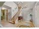 Elegant foyer with staircase, neutral colors, stylish decor, and a grand entrance for a welcoming ambiance at 4541 Greenthread Ct, Zionsville, IN 46077
