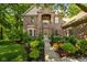 Stunning brick home featuring mature landscaping, a two-story facade, and a welcoming front entrance at 4541 Greenthread Ct, Zionsville, IN 46077