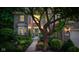 Inviting brick home exterior with beautiful landscaping, a charming front porch, and a well-maintained walkway at 4541 Greenthread Ct, Zionsville, IN 46077