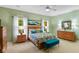 Bright and airy primary bedroom featuring a ceiling fan, soft lighting, and coordinated furniture at 4541 Greenthread Ct, Zionsville, IN 46077