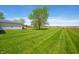 Spacious backyard boasts a meticulously kept lawn, ideal for outdoor activities and relaxation at 4622 W 400 S, Trafalgar, IN 46181