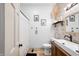 Well-lit bathroom with modern fixtures and a shower with a white curtain at 4622 W 400 S, Trafalgar, IN 46181