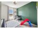 This Bedroom features neutral walls and curtains and a playset at 4622 W 400 S, Trafalgar, IN 46181