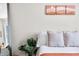 Cozy bedroom featuring modern artwork, mirror, and neutral tones at 4622 W 400 S, Trafalgar, IN 46181