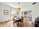 Cozy dining room features wood floors, modern lighting, and scenic views at 4622 W 400 S, Trafalgar, IN 46181