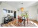 Cozy dining room with modern light fixture, bar and views of the backyard at 4622 W 400 S, Trafalgar, IN 46181