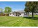Quaint single-story home on a large lot with mature trees and a well-kept lawn at 4622 W 400 S, Trafalgar, IN 46181