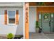 Close-up of the home's charming front entrance, including house numbers at 4622 W 400 S, Trafalgar, IN 46181