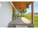Covered front porch featuring rocking chair, perfect for relaxing and enjoying the outdoors at 4622 W 400 S, Trafalgar, IN 46181