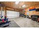 Spacious garage with wood paneled walls, offering ample room for parking, storage, and hobbies at 4622 W 400 S, Trafalgar, IN 46181