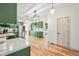 Updated kitchen featuring green cabinets, stainless appliances, and a spacious layout at 4622 W 400 S, Trafalgar, IN 46181