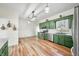 Green kitchen with stainless appliances, ample cabinet space, and natural light at 4622 W 400 S, Trafalgar, IN 46181