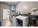 This laundry room features a new washer and dryer and built-in storage shelving at 4622 W 400 S, Trafalgar, IN 46181