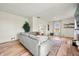 Comfortable living room with a large sectional sofa and hardwood flooring at 4622 W 400 S, Trafalgar, IN 46181