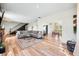 Open-concept living room featuring hardwood floors, modern decor, and a cozy atmosphere at 4622 W 400 S, Trafalgar, IN 46181