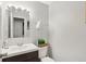 Bathroom features a vanity with dark wood cabinets and a white sink and toilet at 4708 Dorkin Ct, Indianapolis, IN 46254
