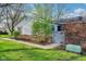 Charming home exterior with a well-maintained lawn, brick accents, and a gated entrance at 4708 Dorkin Ct, Indianapolis, IN 46254