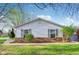 Charming home with well-manicured lawn and garden, shutters and brick accents on exterior at 4708 Dorkin Ct, Indianapolis, IN 46254