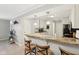 Modern kitchen bar area with granite countertops and adjacent to white kitchen at 4708 Dorkin Ct, Indianapolis, IN 46254