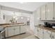 Bright eat-in kitchen boasts granite countertops, white appliances, and an open floor plan at 4708 Dorkin Ct, Indianapolis, IN 46254