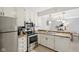 Eat-in kitchen with stainless steel appliances, granite countertops, and white cabinetry at 4708 Dorkin Ct, Indianapolis, IN 46254