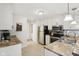 Bright kitchen featuring stainless steel appliances, granite countertops, and ample cabinet space at 4708 Dorkin Ct, Indianapolis, IN 46254