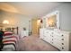 Comfortable bedroom features neutral walls and white dresser at 4710 E 56Th St, Indianapolis, IN 46220