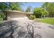 View of the front exterior featuring an attached two-car garage and a driveway at 4710 E 56Th St, Indianapolis, IN 46220