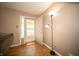 Foyer with hardwood floors and a view to the outside through the front door at 4710 E 56Th St, Indianapolis, IN 46220