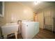 Convenient laundry room with modern washer and dryer, laundry sink, and plenty of space for storage at 4710 E 56Th St, Indianapolis, IN 46220