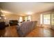 Spacious living room with hardwood floors, neutral walls, and comfortable seating arrangement at 4710 E 56Th St, Indianapolis, IN 46220